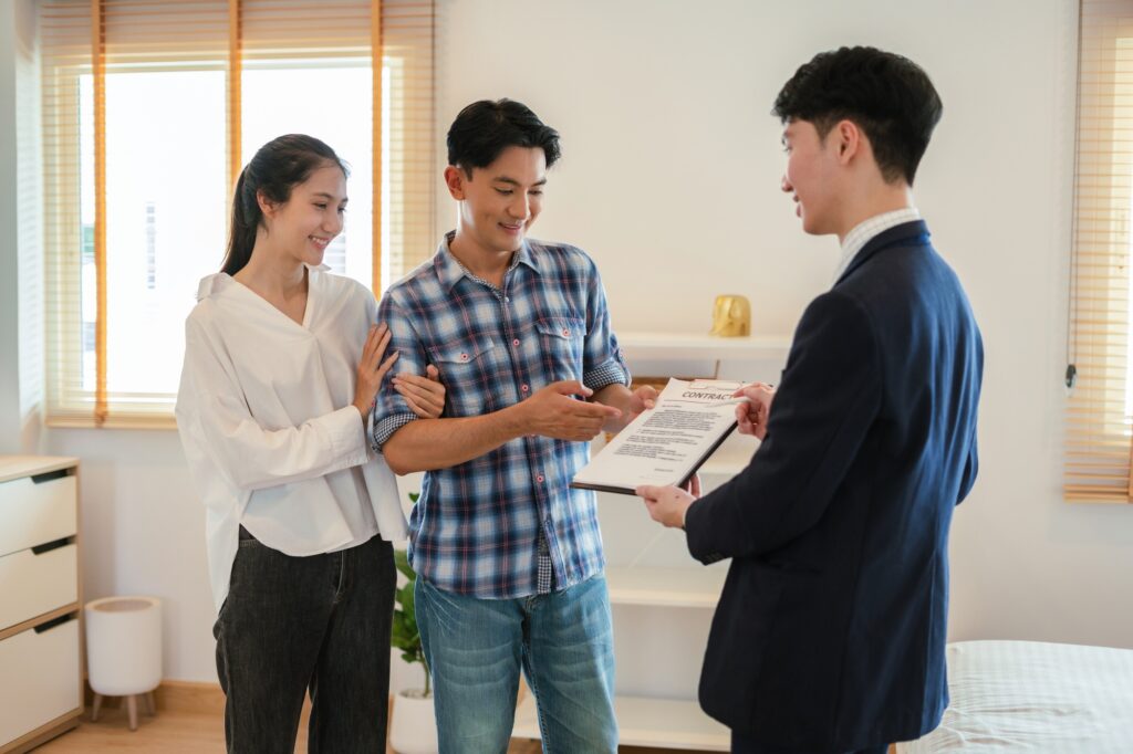 Real estate broker agent presenting and consult to couples